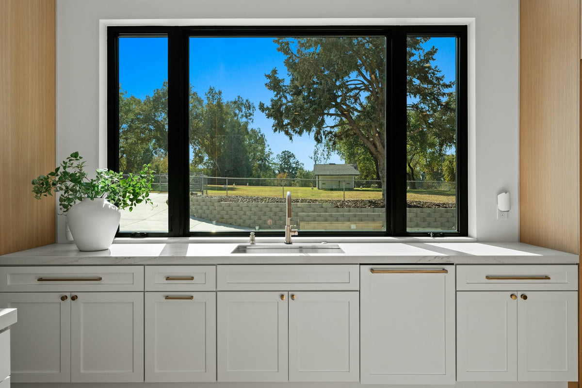 Bright kitchen with a large window over the sink